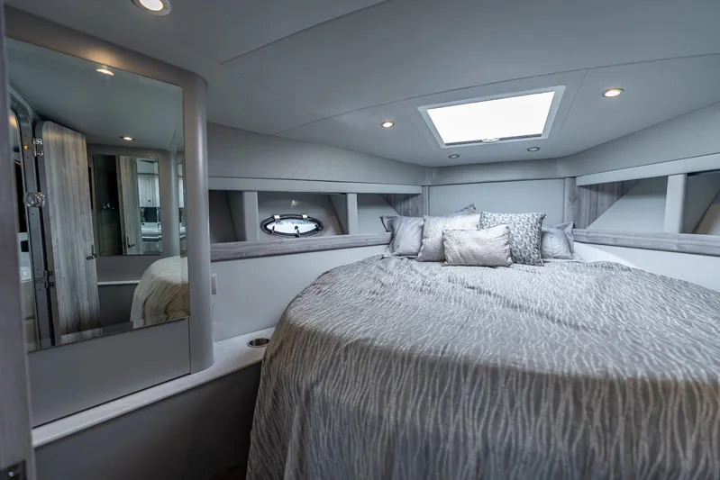  Yacht Photos Pics Luxurious interior of 2022 Formula 40 Performance Cruiser with elegant bedding and modern design.