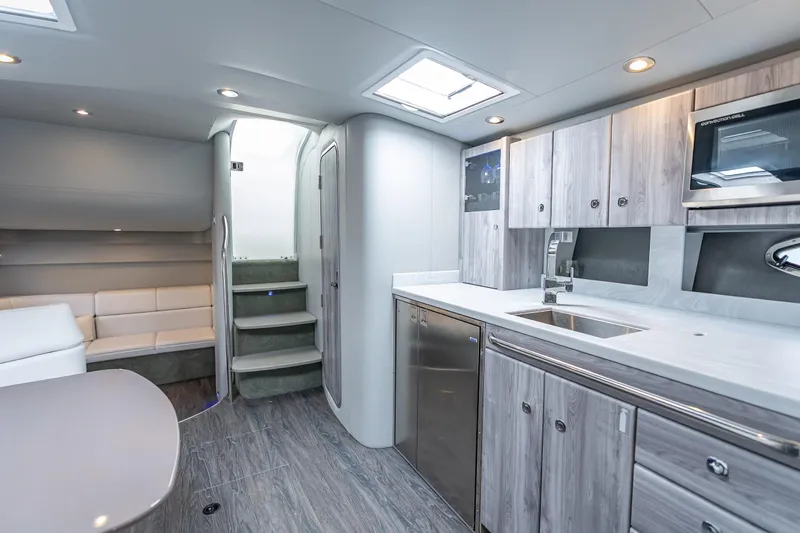 Yacht Photos Pics Luxurious interior of 2022 Formula 40 Performance Cruiser with modern kitchen and seating area.