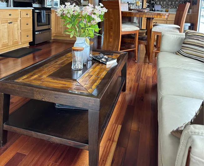 Stock Options Yacht Photos Pics Luxurious houseboat interior with wooden flooring, elegant furniture, and floral centerpiece. Stardust Cruisers 6816, 2000.