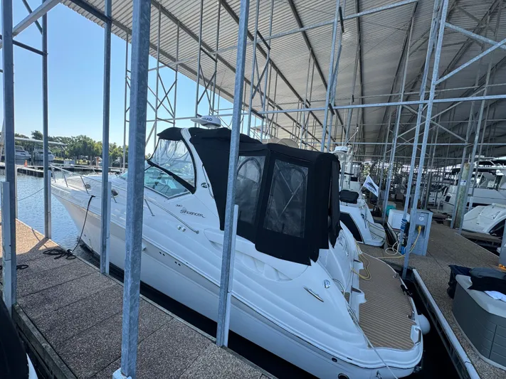 Finalize Yacht Photos Pics 2007 Sea Ray 340 Sundancer docked in a covered marina.