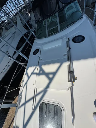 Finalize Yacht Photos Pics 2007 Sea Ray 340 Sundancer boat docked, featuring sleek white deck and modern design.