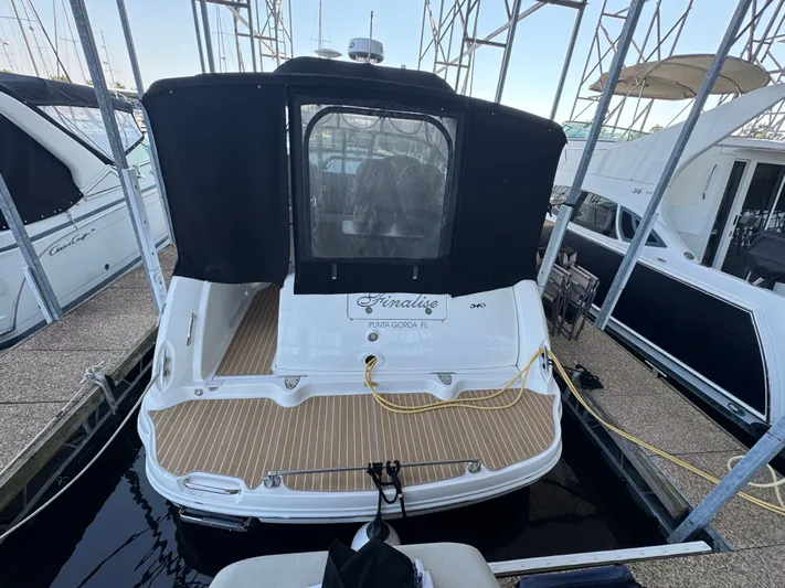 Finalize Yacht Photos Pics 2007 Sea Ray 340 Sundancer docked, featuring a black canopy and wooden deck.