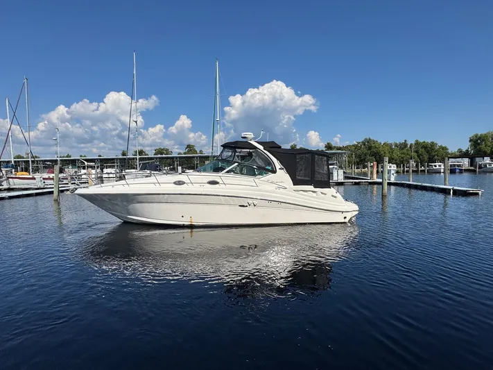 Finalize Yacht Photos Pics 2007 Sea Ray 340 Sundancer yacht docked in a marina under a clear blue sky.