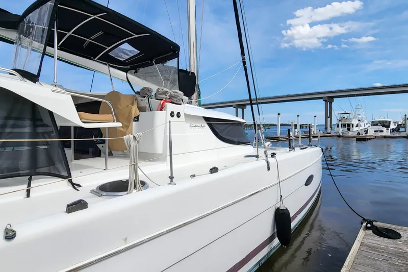 Benevah Yacht Photos Pics 2013 Fountaine Pajot Lipari 41 catamaran docked at marina under clear blue sky.