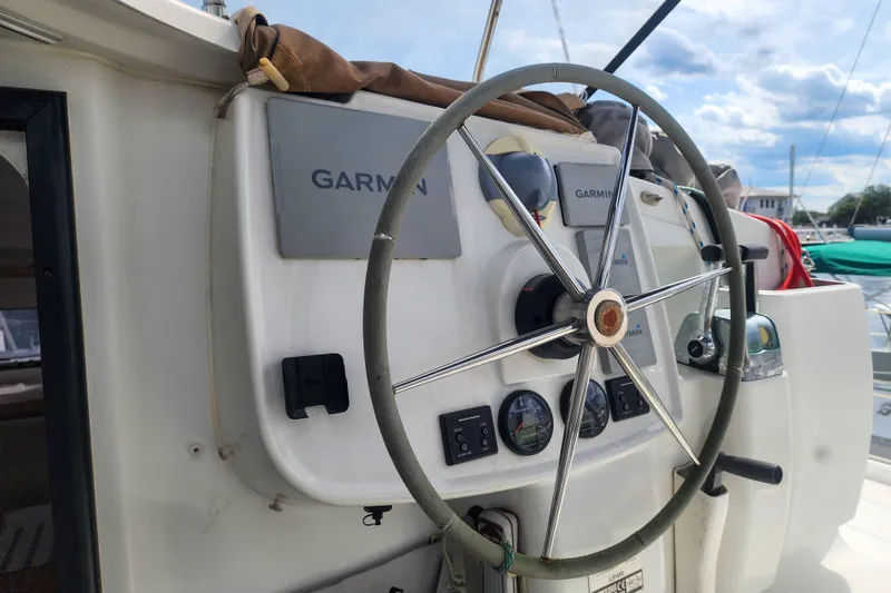 Benevah Yacht Photos Pics Steering wheel of 2013 Fountaine Pajot Lipari 41 catamaran with Garmin navigation system.