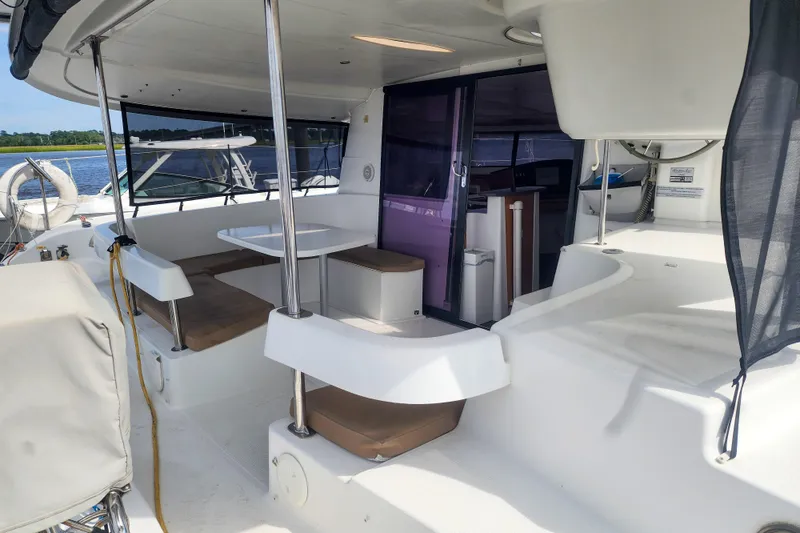 Benevah Yacht Photos Pics 2013 Fountaine Pajot Lipari 41 catamaran with spacious outdoor seating and dining area.