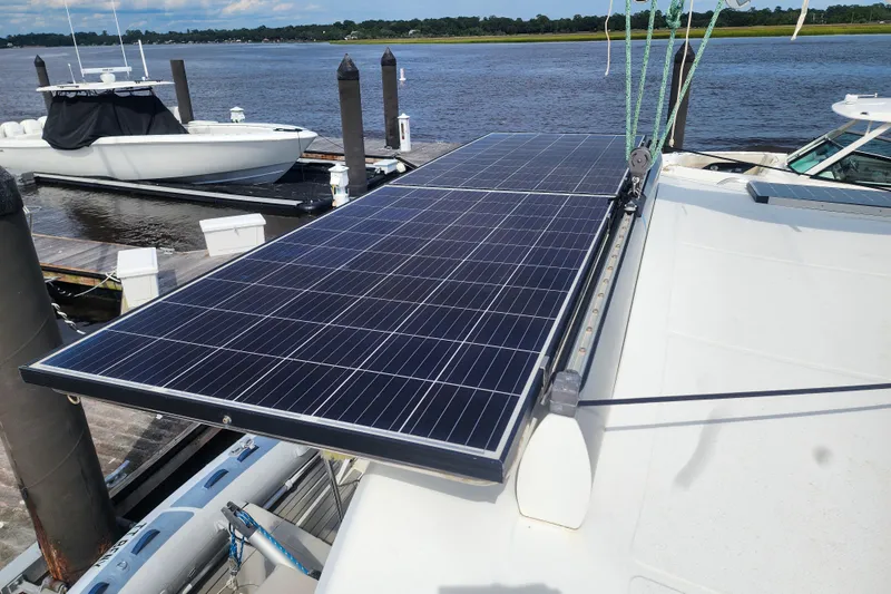 Benevah Yacht Photos Pics Solar panel on 2013 Fountaine Pajot Lipari 41 catamaran docked by the water.