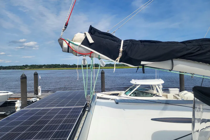 Benevah Yacht Photos Pics 2013 Fountaine Pajot Lipari 41 catamaran with solar panels docked by the water.