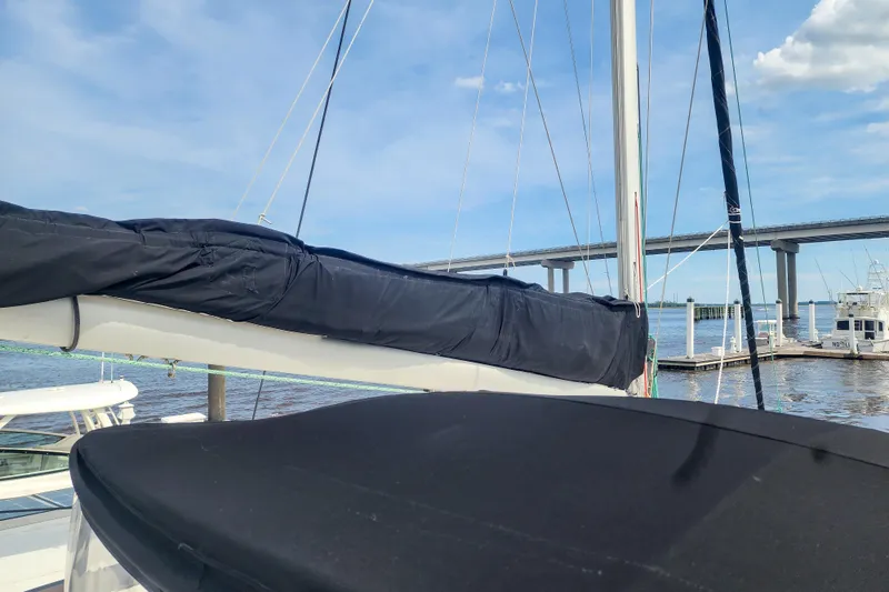 Benevah Yacht Photos Pics 2013 Fountaine Pajot Lipari 41 catamaran docked near a bridge on a sunny day.