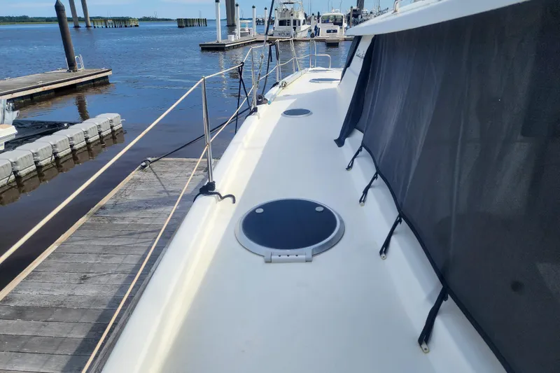 Benevah Yacht Photos Pics 2013 Fountaine Pajot Lipari 41 catamaran docked at marina, side deck view.