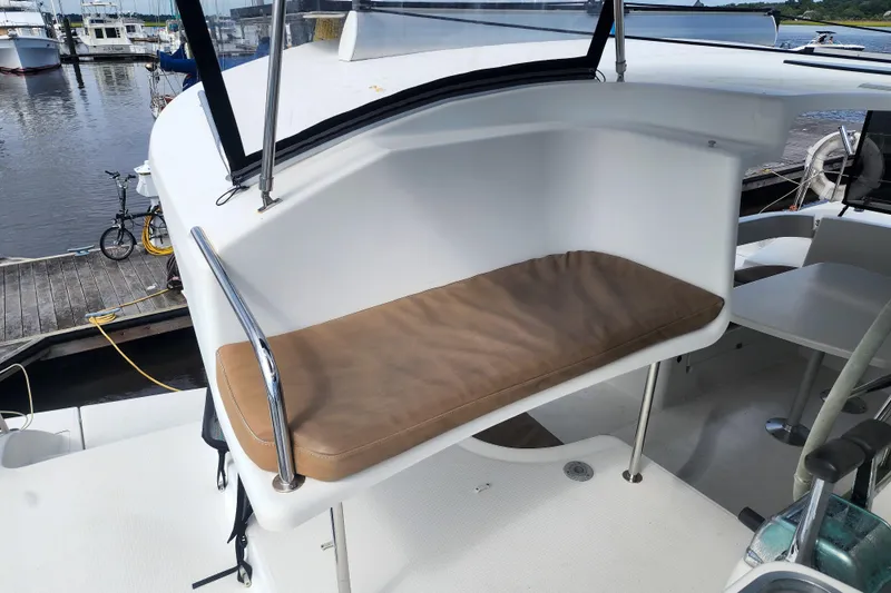 Benevah Yacht Photos Pics 2013 Fountaine Pajot Lipari 41 catamaran helm seat with cushion, docked at marina.