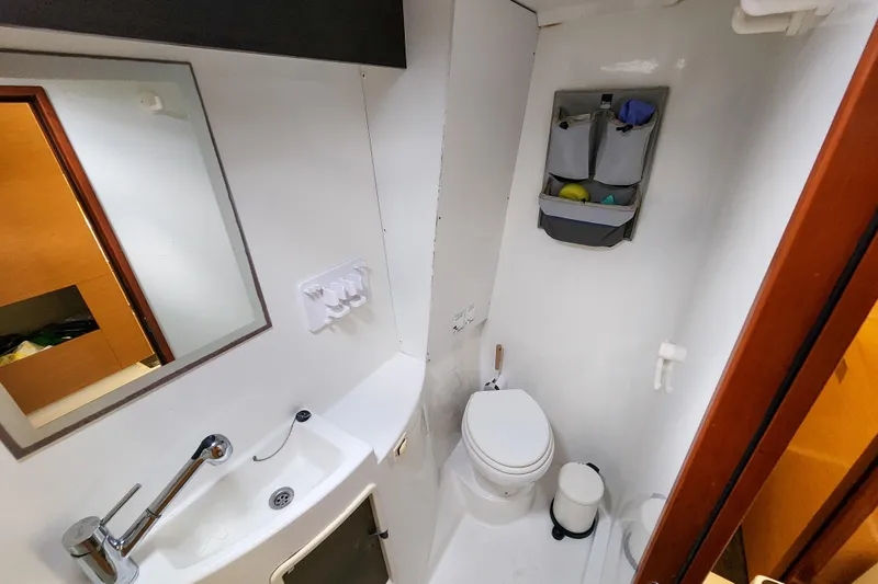 Benevah Yacht Photos Pics Bathroom interior of 2013 Fountaine Pajot Lipari 41 catamaran, featuring sink and toilet.