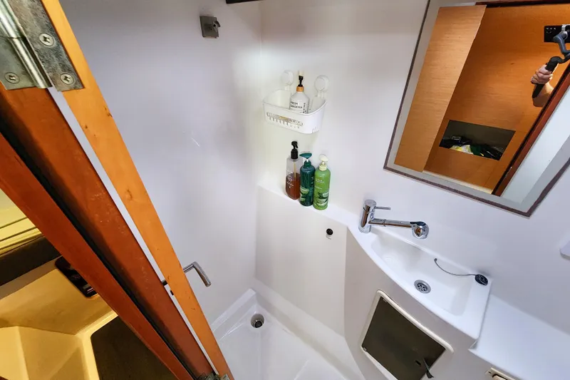 Benevah Yacht Photos Pics Bathroom interior of 2013 Fountaine Pajot Lipari 41 catamaran with sink and toiletries.