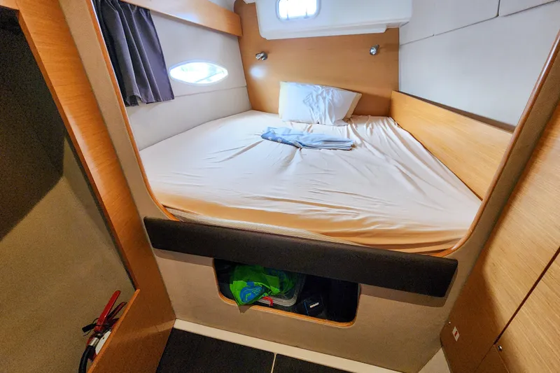 Benevah Yacht Photos Pics Cozy cabin interior of 2013 Fountaine Pajot Lipari 41 catamaran with bed and storage.