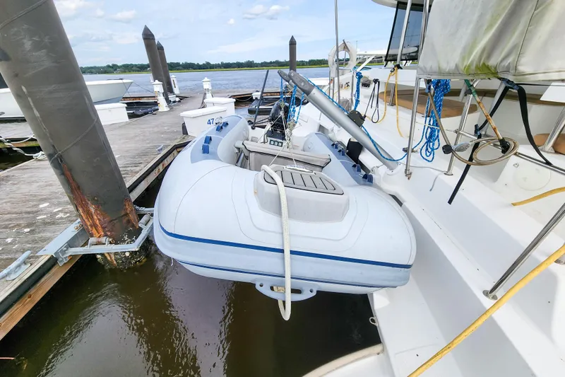 Benevah Yacht Photos Pics 2013 Fountaine Pajot Lipari 41 catamaran with dinghy docked at marina.