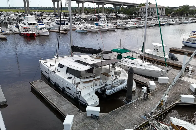 Benevah Yacht Photos Pics 2013 Fountaine Pajot Lipari 41 catamaran docked at a marina with multiple boats.