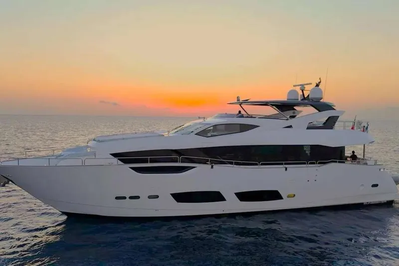  Yacht Photos Pics 2022 Sunseeker 95 Yacht cruising at sunset on open sea.