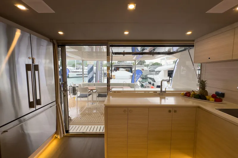  Yacht Photos Pics Modern kitchen interior of 2025 Aquila 50 Yacht with sleek design and outdoor view.