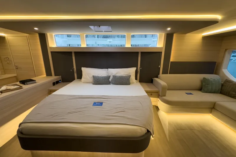  Yacht Photos Pics Luxurious interior of 2025 Aquila 50 Yacht with modern bedroom design and ambient lighting.