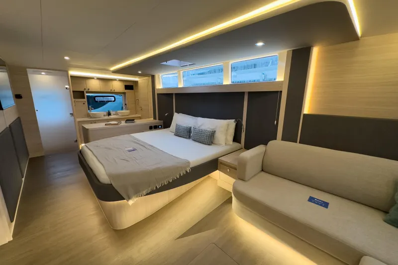  Yacht Photos Pics Luxurious interior of 2025 Aquila 50 Yacht with modern bedroom and elegant lighting.