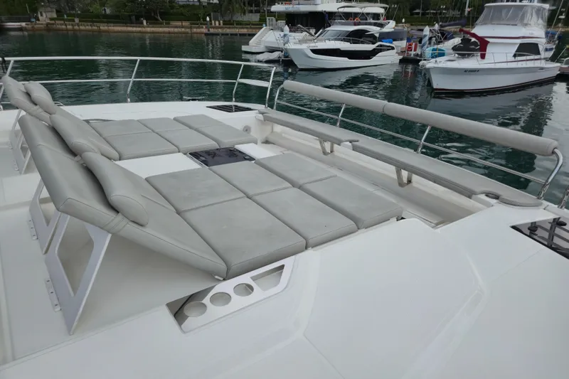  Yacht Photos Pics Luxurious 2025 Aquila 50 Yacht with spacious sunbathing deck and comfortable seating.