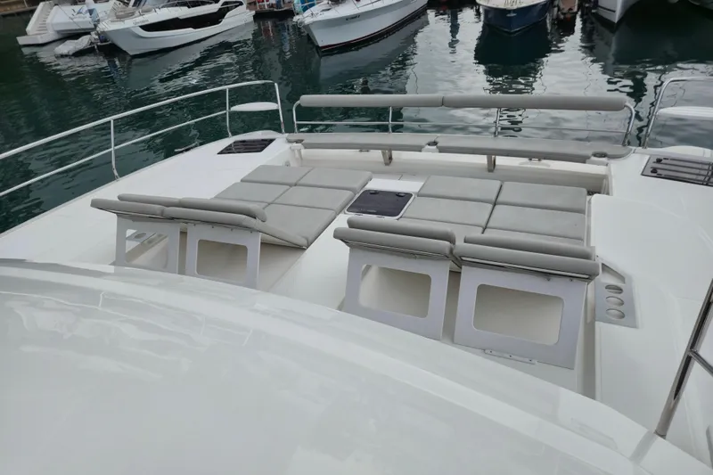  Yacht Photos Pics Aquila 50 Yacht 2025 model with spacious deck and cushioned seating.