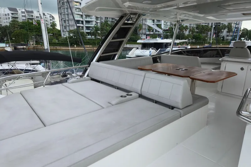  Yacht Photos Pics Luxurious 2025 Aquila 50 Yacht with spacious seating and elegant wooden table.
