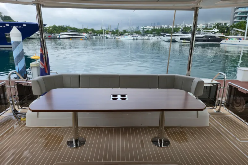  Yacht Photos Pics Aquila 50 Yacht 2025, elegant deck seating with marina view.