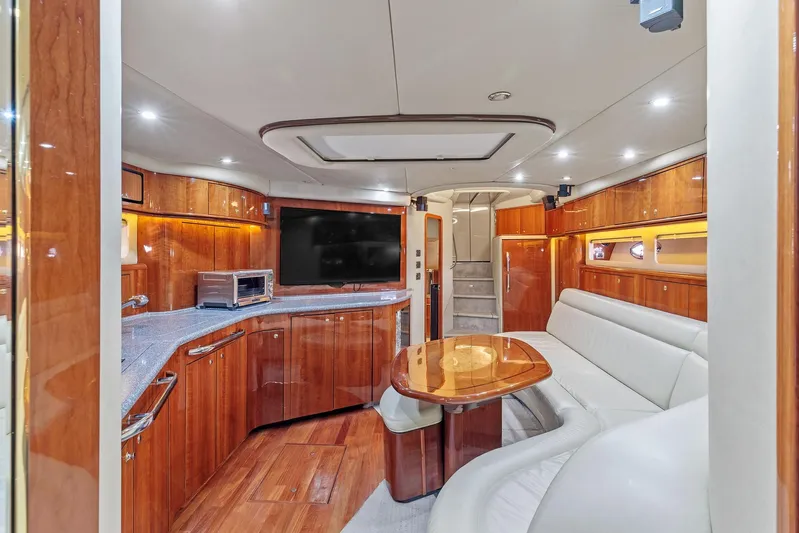  Yacht Photos Pics Luxurious interior of 2002 Sea Ray 550 Sundancer yacht with wood finishes and modern amenities.