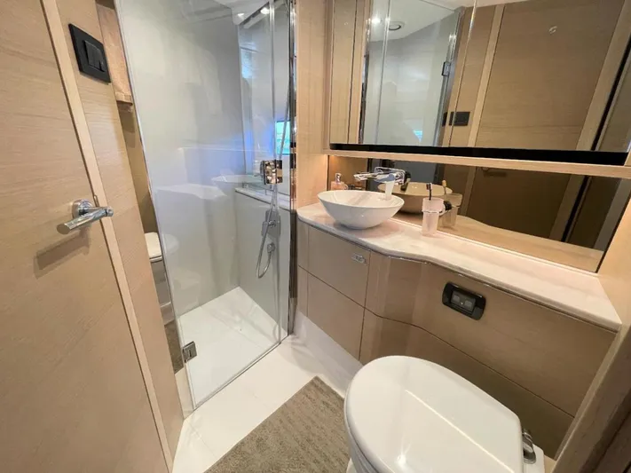 Placid Yacht Photos Pics Luxurious bathroom in 2019 Princess F55 yacht with modern fixtures and elegant design.