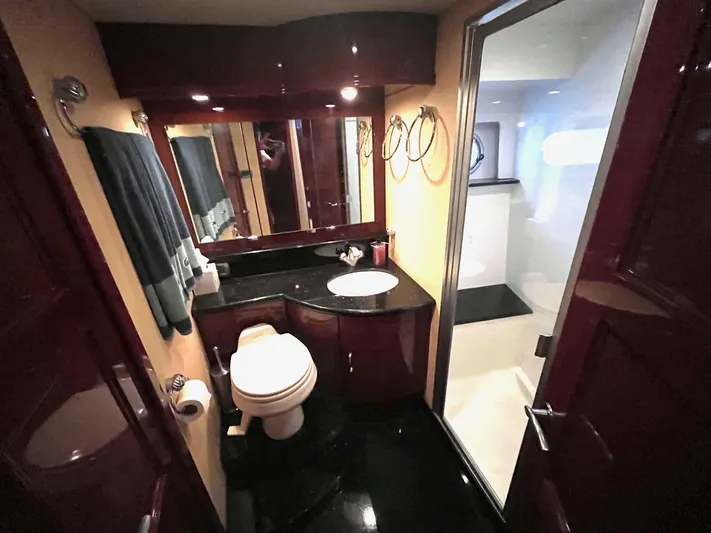 Juli's Priority Yacht Photos Pics Luxurious bathroom in 2004 Marquis 59 yacht with modern fixtures and elegant design.