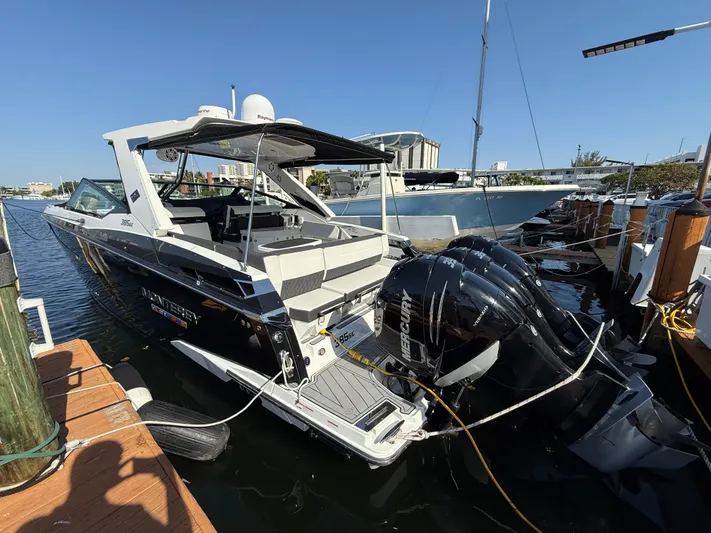  Yacht Photos Pics 2020 Monterey 385 Super Express boat docked with powerful outboard engines.