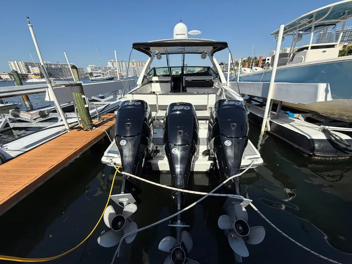  Yacht Photos Pics 2020 Monterey 385 Super Express boat docked with triple outboard engines.