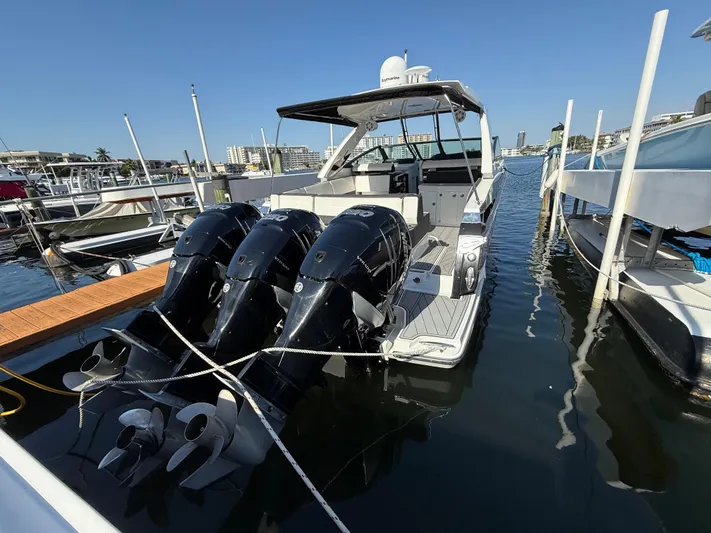  Yacht Photos Pics 2020 Monterey 385 Super Express boat docked with triple outboard engines.