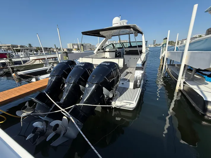  Yacht Photos Pics 2020 Monterey 385 Super Express boat docked with triple outboard engines.