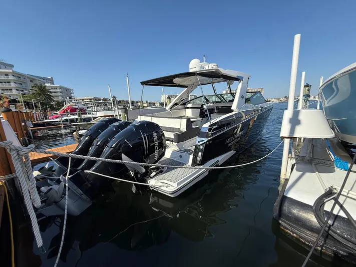  Yacht Photos Pics 2020 Monterey 385 Super Express boat docked with triple outboard engines.