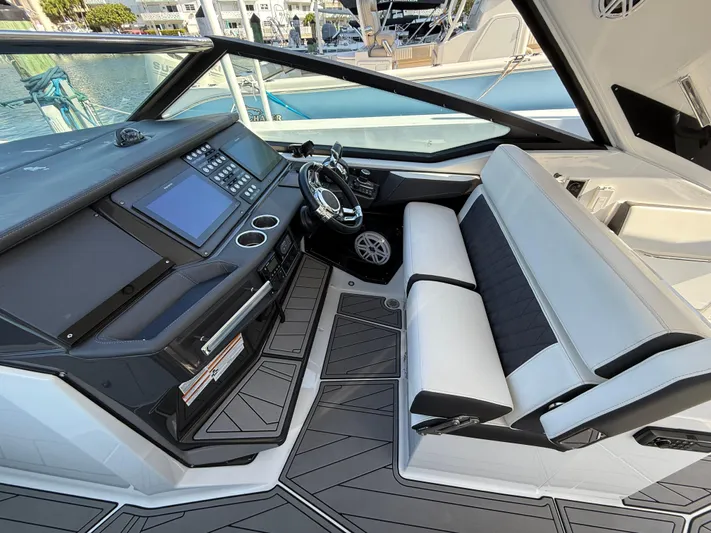  Yacht Photos Pics 2020 Monterey 385 Super Express cockpit with modern controls and sleek seating.