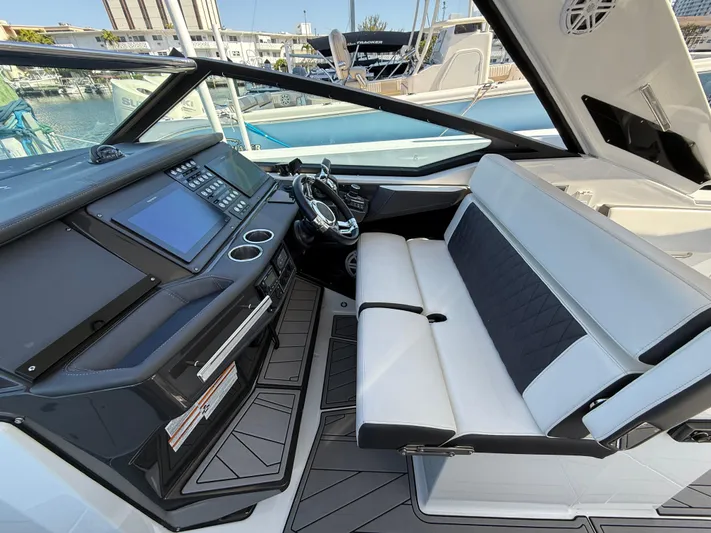  Yacht Photos Pics 2020 Monterey 385 Super Express cockpit with modern dashboard and seating.