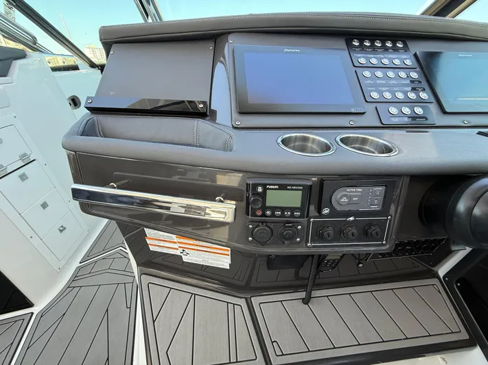  Yacht Photos Pics Control panel of a 2020 Monterey 385 Super Express boat with modern navigation equipment.