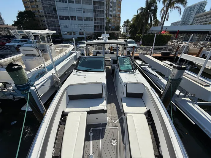  Yacht Photos Pics 2020 Monterey 385 Super Express boat docked, featuring spacious seating and sleek design.