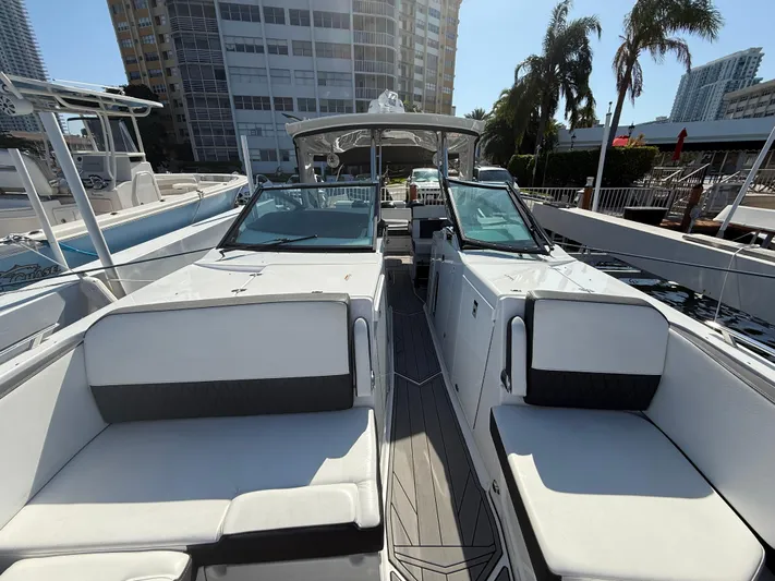  Yacht Photos Pics 2020 Monterey 385 Super Express yacht with sleek design, docked in a marina.