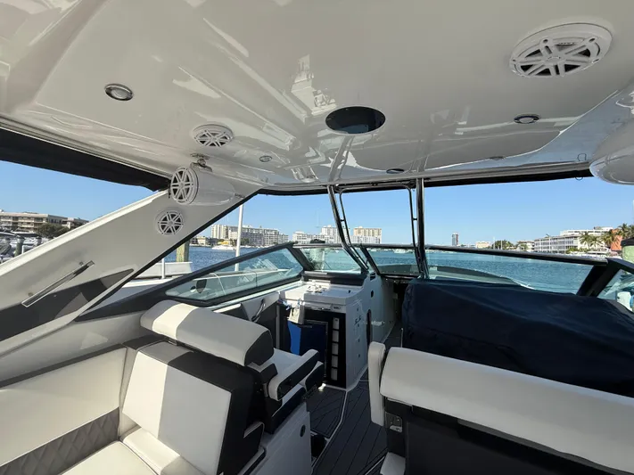  Yacht Photos Pics 2020 Monterey 385 Super Express yacht interior with luxurious seating and waterfront view.