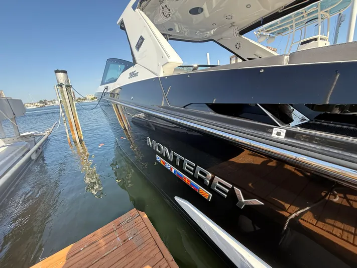  Yacht Photos Pics 2020 Monterey 385 Super Express boat docked at marina, side view.