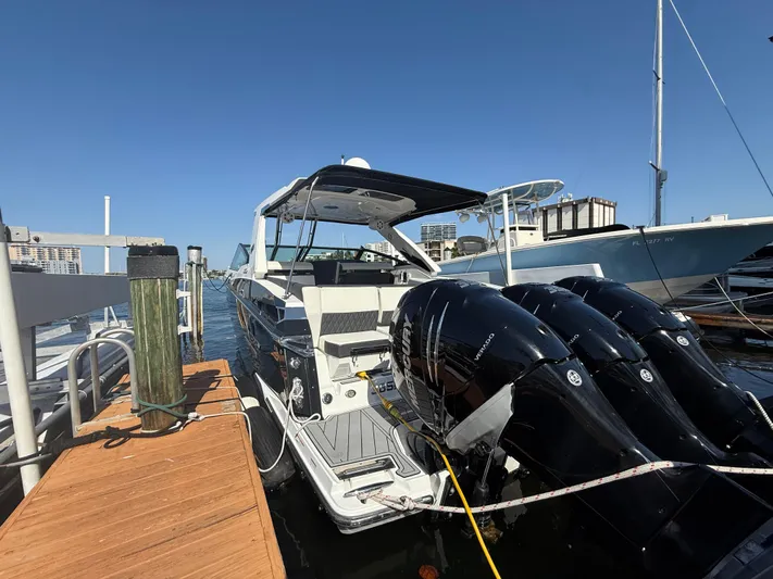  Yacht Photos Pics 2020 Monterey 385 Super Express boat docked with triple outboard engines.
