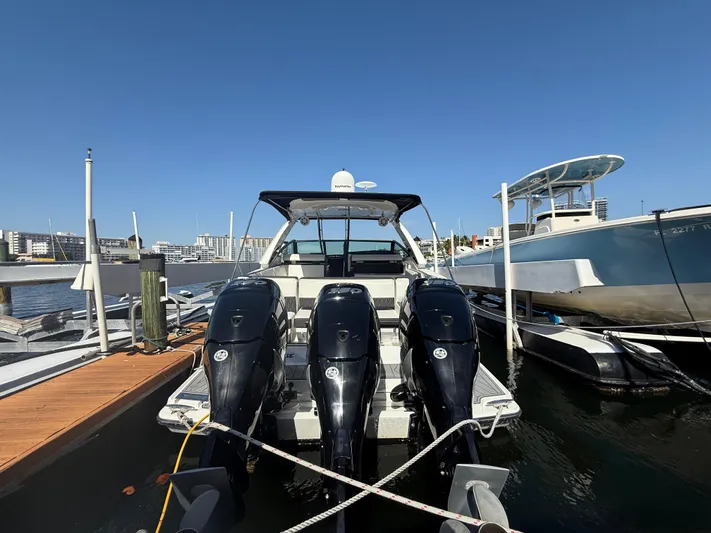  Yacht Photos Pics 2020 Monterey 385 Super Express boat docked with triple outboard engines.