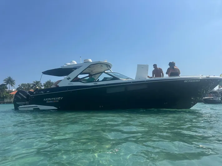  Yacht Photos Pics 2020 Monterey 385 Super Express boat on clear water with people onboard.