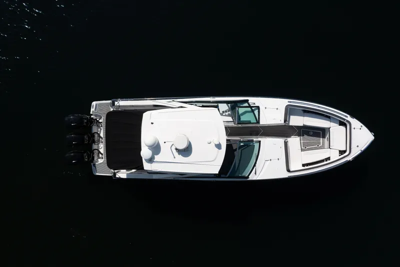  Yacht Photos Pics Overhead view of 2020 Monterey 385 Super Express boat on dark water.