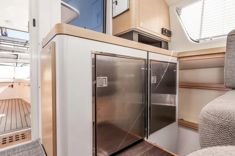  Yacht Photos Pics Interior of 2014 Outremer 51 yacht with modern kitchen and stainless steel appliances.