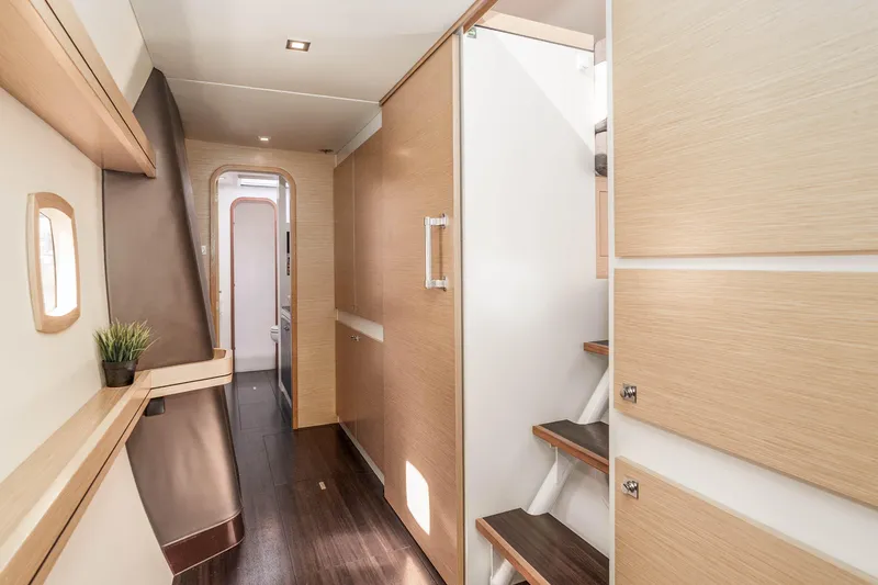  Yacht Photos Pics Interior of 2014 Outremer 51 yacht, featuring modern wood paneling and sleek design.