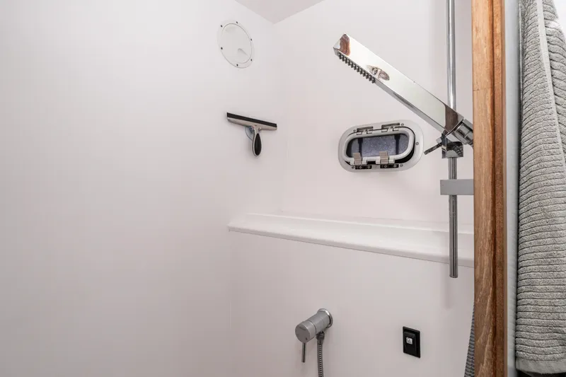  Yacht Photos Pics Shower area in 2014 Outremer 51 yacht with window and towel.